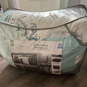 From walmart, like new Queen size bed set! Teal, comes with throw pillows!